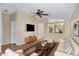 Spacious living room showcases a striped rug, a ceiling fan, and an open layout into the kitchen at 201 S Greenfield Rd # 173, Mesa, AZ 85206
