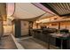 Outdoor kitchen setup with shade sails, BBQ, storage, and counter space at 201 S Greenfield Rd # 173, Mesa, AZ 85206