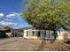 Charming single-story home featuring desert landscaping and a covered parking area, perfect for easy access at 2359 S Tomahawk Rd, Apache Junction, AZ 85119