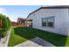 Relaxing backyard oasis features artificial turf and a charming covered patio for outdoor enjoyment at 27510 N 30Th Ln, Phoenix, AZ 85083