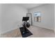 Bright bedroom with a Peloton bike, fitness ball, and a full-length mirror, ideal for a home gym at 27510 N 30Th Ln, Phoenix, AZ 85083