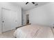 Neutral bedroom with a large closet, bright white walls, carpet, and a ceiling fan at 27510 N 30Th Ln, Phoenix, AZ 85083