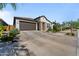 Charming exterior with stone accents, a two-car garage, and manicured landscaping at 27510 N 30Th Ln, Phoenix, AZ 85083