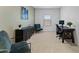 Inviting home office with modern furnishings, including a sleek desk, comfortable chairs, and stylish decor at 27510 N 30Th Ln, Phoenix, AZ 85083
