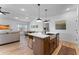 Bright open floorplan with a kitchen island and stainless appliances at 27510 N 30Th Ln, Phoenix, AZ 85083
