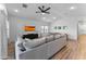 Spacious living room featuring a comfy sectional sofa, TV, and adjacent dining area at 27510 N 30Th Ln, Phoenix, AZ 85083