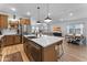 Spacious kitchen with island flows into dining and living areas, creating an inviting open floor plan at 27510 N 30Th Ln, Phoenix, AZ 85083