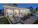 Backyard patio features a built in fire pit, comfortable lounge furniture, and access to the home's interior at 3237 E Park Ave, Gilbert, AZ 85234