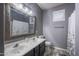 Beautiful bathroom features a large mirror, double sinks, and elegant decor at 3237 E Park Ave, Gilbert, AZ 85234