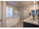 Bright bathroom features a soaking tub, walk-in shower, and double sink vanity at 3237 E Park Ave, Gilbert, AZ 85234