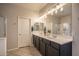 Bathroom boasts double sinks, granite counters, and a walk-in shower at 3237 E Park Ave, Gilbert, AZ 85234