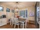 Elegant dining room featuring a stylish chandelier and lots of natural light offers an inviting space for meals at 3237 E Park Ave, Gilbert, AZ 85234