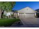 Attractive single-story home with a three-car garage, landscaped front yard, and well-lit entrance at 3237 E Park Ave, Gilbert, AZ 85234
