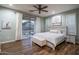 Comfortable main bedroom with hardwood floors, backyard views, and a private ensuite bathroom creates a relaxing retreat at 3237 E Park Ave, Gilbert, AZ 85234