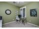 Home office featuring a sleek glass desk and wall-mounted certificates at 3237 E Park Ave, Gilbert, AZ 85234