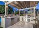 Outdoor kitchen features a built-in grill, sink, and refrigerator at 3237 E Park Ave, Gilbert, AZ 85234