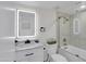 Bathroom with a sleek, modern vanity with illuminated mirror and black fixtures at 3401 N 37Th St # 14, Phoenix, AZ 85018