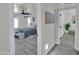 Inviting bedroom with neutral decor, sliding barn door, and light wood floors at 3401 N 37Th St # 14, Phoenix, AZ 85018