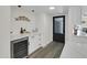 Stylish coffee bar featuring quartz countertops, white cabinets, and a wine refrigerator at 3401 N 37Th St # 14, Phoenix, AZ 85018