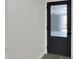 Sleek black door with obscure glass panel and modern hardware at 3401 N 37Th St # 14, Phoenix, AZ 85018