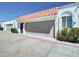 Exterior showcasing a red tile roof, private garage, and stucco facade detailing and decorative ironwork at 3401 N 37Th St # 14, Phoenix, AZ 85018