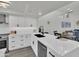 Modern kitchen with white cabinets, stainless steel appliances, and sleek countertops at 3401 N 37Th St # 14, Phoenix, AZ 85018