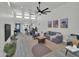 Open-concept living room with high ceilings, modern furnishings, and abundant natural light at 3401 N 37Th St # 14, Phoenix, AZ 85018