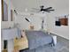 Bright bedroom boasts gray wood-look floors, and modern ceiling fan at 3401 N 37Th St # 14, Phoenix, AZ 85018
