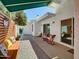 Charming back patio with comfortable seating surrounded by lush landscaping and relaxing ambiance at 3401 N 37Th St # 14, Phoenix, AZ 85018