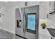 Stainless steel smart refrigerator with digital display and water dispenser complements the modern kitchen design at 3401 N 37Th St # 14, Phoenix, AZ 85018
