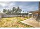 Spacious backyard with a patio area, mature trees, providing a serene outdoor space at 3701 E Karen Dr, Phoenix, AZ 85032