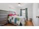 Comfortable bedroom with wood floor, natural light from the window, and stylish furniture at 3701 E Karen Dr, Phoenix, AZ 85032