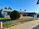 Single-story home with desert landscaping and mature tree in the front yard at 3701 E Karen Dr, Phoenix, AZ 85032