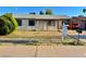 Charming single-story home with a covered porch and desert landscaping in a residential neighborhood at 3701 E Karen Dr, Phoenix, AZ 85032