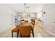 Bright kitchen featuring white cabinets, stainless steel appliances, and dining area with seating at 3701 E Karen Dr, Phoenix, AZ 85032