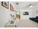 Bright living room with white walls, blue seating, and decorative accents at 3701 E Karen Dr, Phoenix, AZ 85032