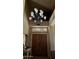 Welcoming foyer showcasing a decorative chandelier and custom wooden double doors with transom window at 4018 E Adobe Dr, Phoenix, AZ 85050