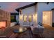 Back patio with outdoor brick fireplace, french doors and comfortable patio furniture at 4021 E Glenrosa Ave, Phoenix, AZ 85018