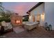 Back patio features a cozy outdoor brick fireplace and comfortable patio furniture at 4021 E Glenrosa Ave, Phoenix, AZ 85018