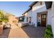 Beautiful backyard featuring a brick fireplace, outdoor seating area, and covered patio at 4021 E Glenrosa Ave, Phoenix, AZ 85018