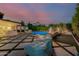 A backyard featuring a stunning pool, outdoor seating, and lush greenery, perfect for outdoor living at 4021 E Glenrosa Ave, Phoenix, AZ 85018