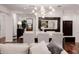 Bright dining room featuring a modern chandelier and a view into the home's entryway at 4021 E Glenrosa Ave, Phoenix, AZ 85018