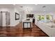 Spacious dining area with wood floors, modern lighting, and access to the outdoor living space at 4021 E Glenrosa Ave, Phoenix, AZ 85018