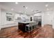 Bright kitchen boasts hardwood floors, stainless appliances, marble countertops, and a kitchen island with barstool seating at 4021 E Glenrosa Ave, Phoenix, AZ 85018