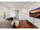 Stylish living room with modern furnishings, a sleek TV, and wood flooring at 4021 E Glenrosa Ave, Phoenix, AZ 85018