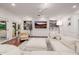 Cozy living room with built-in shelves, modern lighting, and access to the outdoors at 4021 E Glenrosa Ave, Phoenix, AZ 85018