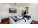 Bright living room featuring modern decor, a large TV, and views into another room at 4021 E Glenrosa Ave, Phoenix, AZ 85018