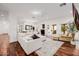 A bright, open-concept living area featuring wood floors, modern lighting, and neutral decor at 4021 E Glenrosa Ave, Phoenix, AZ 85018