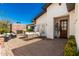 The brick patio has an outdoor brick fireplace, a seating area, and access to the house via French doors at 4021 E Glenrosa Ave, Phoenix, AZ 85018