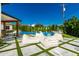 Beautiful pool area with lush landscaping, comfortable beanbag seating, and a view of the covered patio at 4021 E Glenrosa Ave, Phoenix, AZ 85018